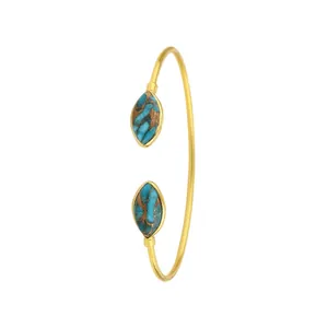 Bracciale rigido aperto dorato da donna con pietre turchesi taglio marquise in acciaio