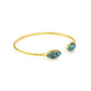 Bracciale rigido aperto dorato regolabile con due ciondoli a foglia di turchese