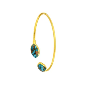 Bracciale rigido aperto dorato con due pietre turchesi a forma di foglia stile boho