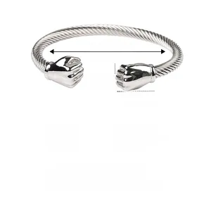 Close-up of twisted stainless steel cable bracelet with fist charms and measurements