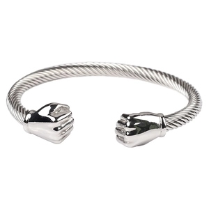 Detail of silver twisted cable stainless steel bracelet with fist-shaped ends
