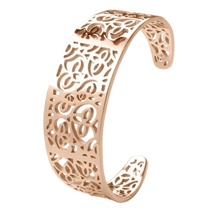 Detailed macro of rose gold cutout flower and honeycomb pattern on stainless steel cuff