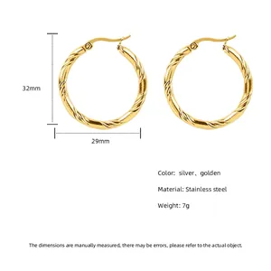 Golden twisted rope hoop earrings in stainless steel with 32mm diameter dimensions