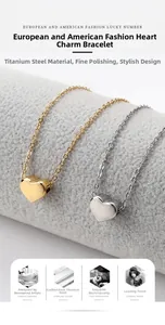 Detail of heart-shaped titanium steel anklets in polished gold and silver finishes