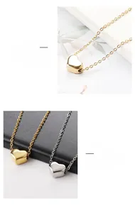 Detail of minimalist 3D heart pendant necklace with vacuum plating and glossy mirror finish