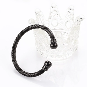 Black twisted cable stainless steel cuff bracelet with polished gold spherical beads