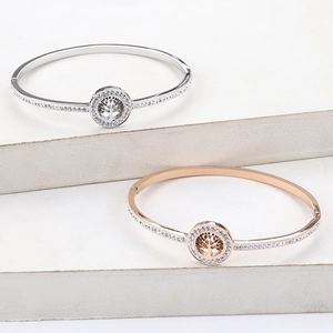 Polished stainless steel Tree of Life bangles with crystals in silver and rose gold finishes