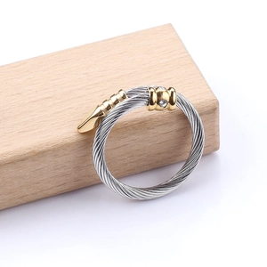 Twisted cable stainless steel ring with gold-tone accents and cubic zirconia stones