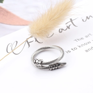 Detailed view of silver twisted cable open ring with crystal accent on white card