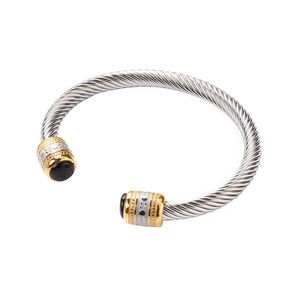 Two-tone twisted cable bangle with black onyx stone caps in stainless steel