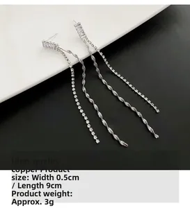 Detail of silver tassel earrings showing 9cm length and premium cubic zirconia inlay