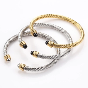 Three-piece set of twisted cable wire cuff bracelets in gold and silver finish