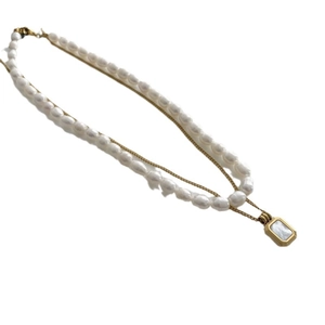 Double-layer necklace with freshwater pearls, titanium steel chain and shell pendant