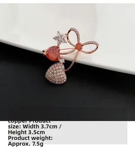 Detail of red zircon heart brooch in premium copper with elegant rose gold plating