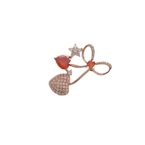 Elegant cherry brooch with orange heart gemstone and white crystals on rose gold metal