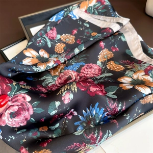 Close-up of French rose print square scarf showing vibrant floral patterns and silky satin texture