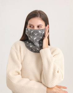 Detailed view of women's thick thermal neck gaiter with white bear patterns in dark grey
