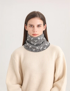 Detail of grey knitted neck warmer featuring a cute white bear pattern for winter warmth