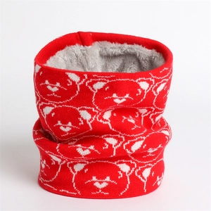Detail of red knit neck warmer with bear pattern and thick grey fleece lining for winter