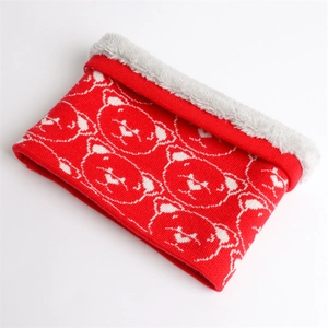 Detailed close-up of knit neck warmer showing red bear pattern and grey plush lining