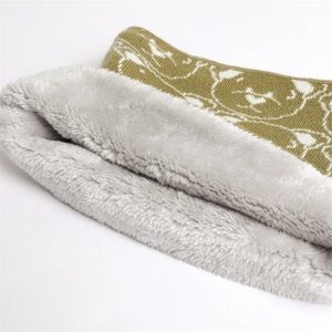 Detail of winter knit neck warmer with olive bear pattern and thick faux fur lining