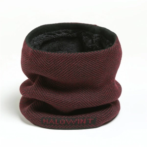 Detail of red and black chevron knit neck warmer with thick black fleece lining