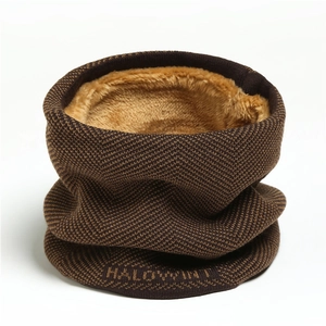 Close-up of herringbone knit neck warmer featuring soft fleece lining and logo detail