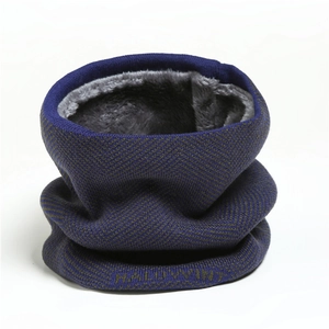 Macro shot of knitted neck warmer with thick gray fleece lining and HALLOWIN lettering