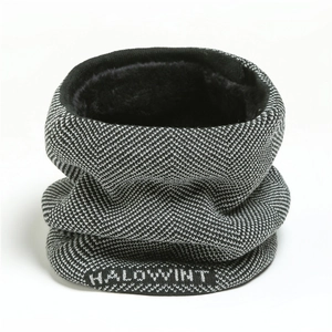 Macro detail of herringbone knit pattern with plush fleece lining and white logo text