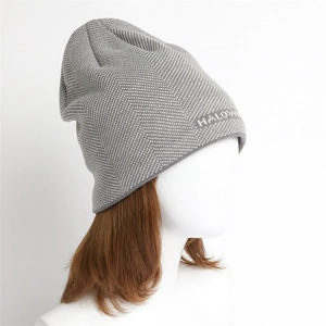 Detailed knit of gray herringbone beanie featuring white HALLOWEEN lettering on side