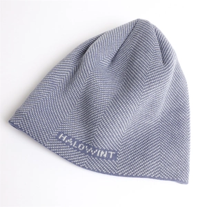 Close-up of purple herringbone knit beanie with H.ALOWINT text detail on hem