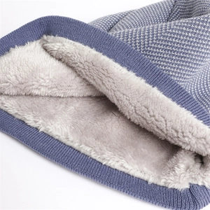 Navy herringbone knit beanie with thick grey fleece lining for winter warmth