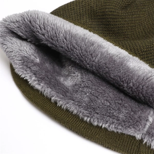 Detailed close-up of olive green knit hat with thick gray fleece lining for warmth