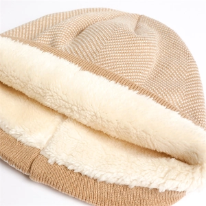 Detail of warm knit hat showing khaki herringbone pattern and thick white fleece lining