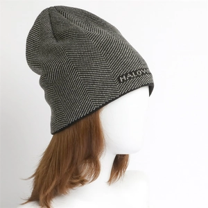 Detailed close-up of herringbone knit pattern and HALOW logo on a warm winter beanie