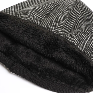 Detail of winter knit hat featuring herringbone pattern and thick faux fleece lining