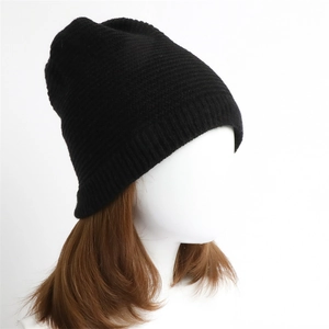 Detailed texture of black ribbed knit beanie showing high-quality stitching and warmth