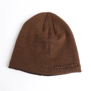 Detailed view of dark brown knitted beanie with herringbone texture and Halowint logo