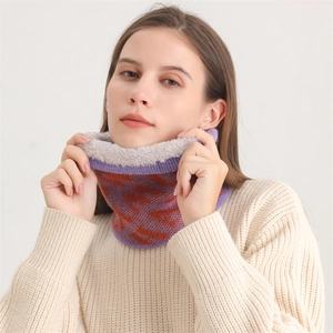Detail of knitted neck warmer showing thick grey fleece lining and purple geometric pattern