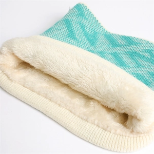 Winter knitted neck warmer with teal geometric patterns and thick faux fur lining