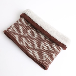 Detail of knit snood showing brown letters and soft white faux fur lining texture