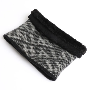 Detail of knit neck warmer showing black and grey geometric patterns and thick plush lining