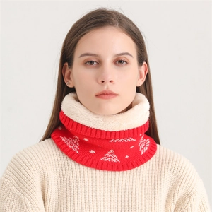 Detail of red Christmas knit neck warmer with white snowflake patterns and plush lining
