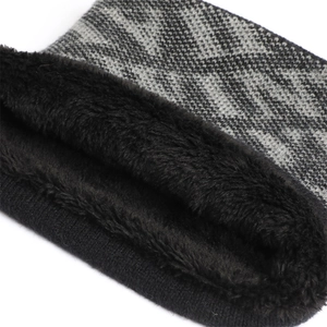 Detail of warm winter neck warmer with gray knit pattern and thick black fleece lining