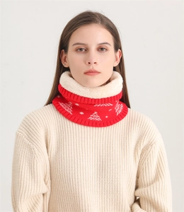 Detailed view of knitted scarf with thick white fleece lining and Christmas tree pattern