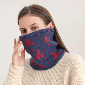 Detail of navy knit neck warmer with red Christmas tree pattern and ribbed edges
