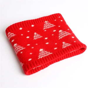 Close-up of red and white knitted neck warmer with festive Christmas tree pattern