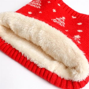 Close-up of winter knit neck gaiter with warm fleece lining and festive snowflake pattern