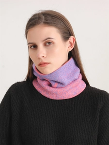 Detail of pink and purple gradient knit scarf showing thick warm texture and pattern