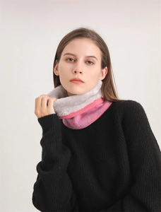 Detail of winter neck warmer with pink gradient knit and thick faux fur lining texture